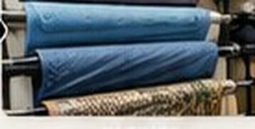 Rolled fabric bolts on a rack